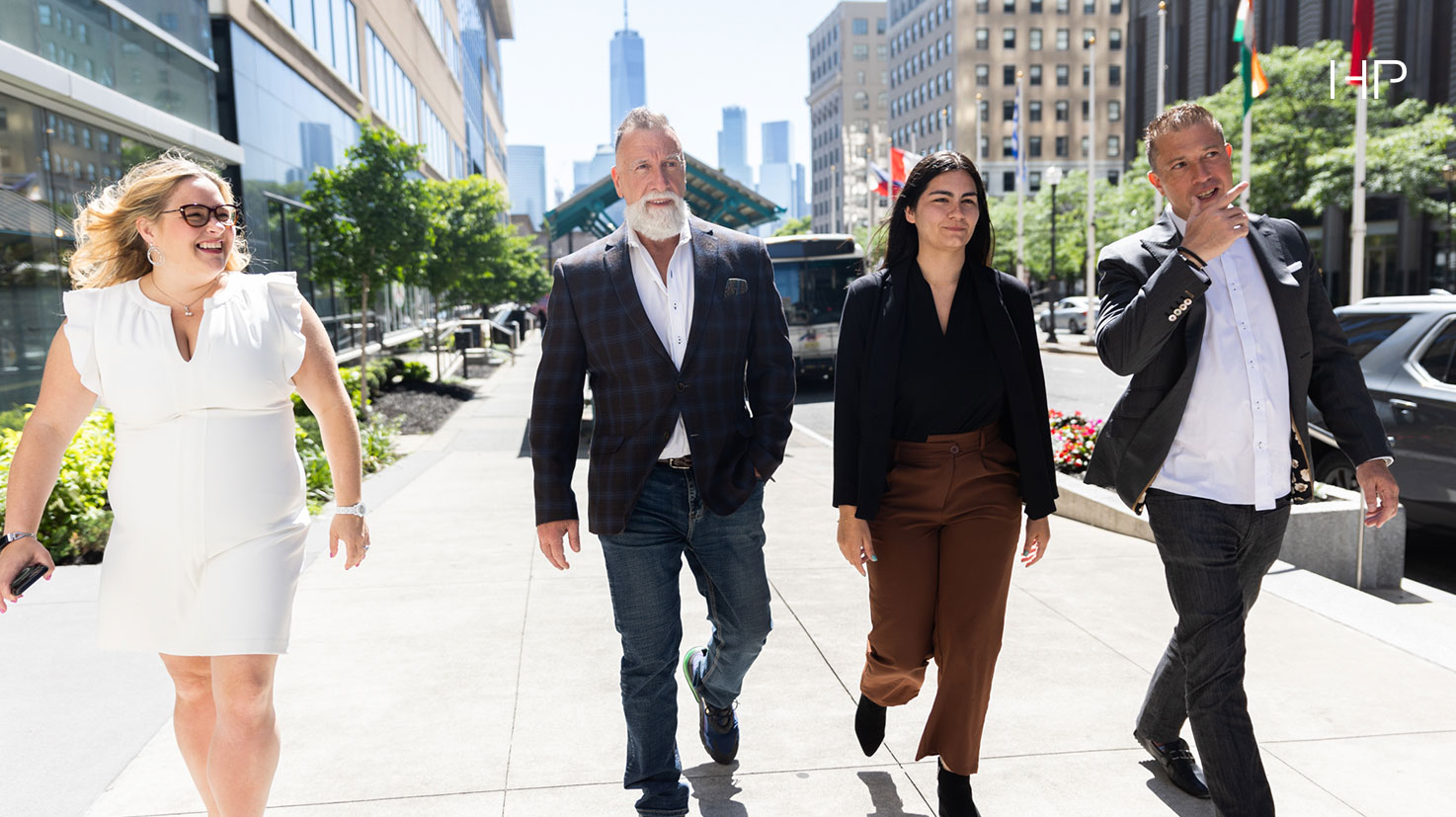 Team Walking On Sidewalk